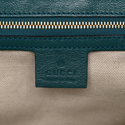 Azalea Calfskin Enamel Matelasse Diagonal Small Torchon GG Marmont Shoulder Bag Imperial Blue Pavone